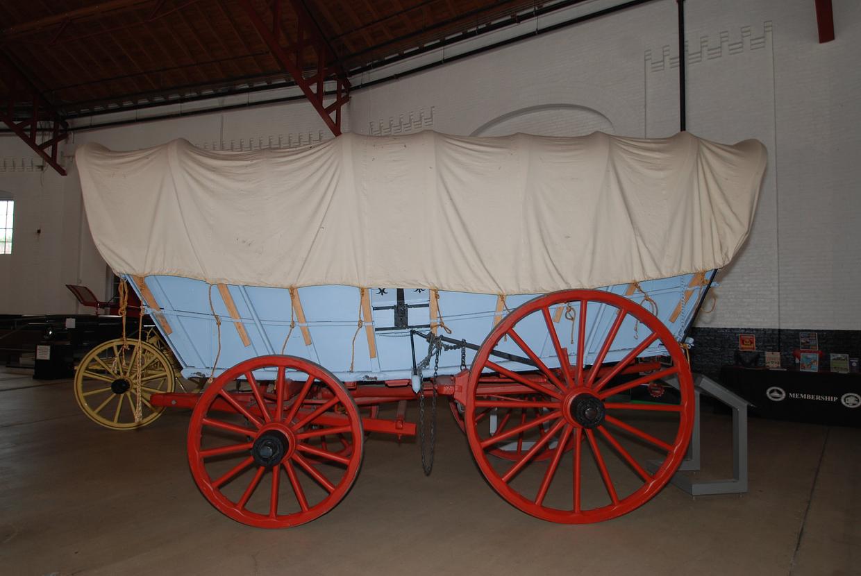 an image of a real wagon with 2 different sized wheels