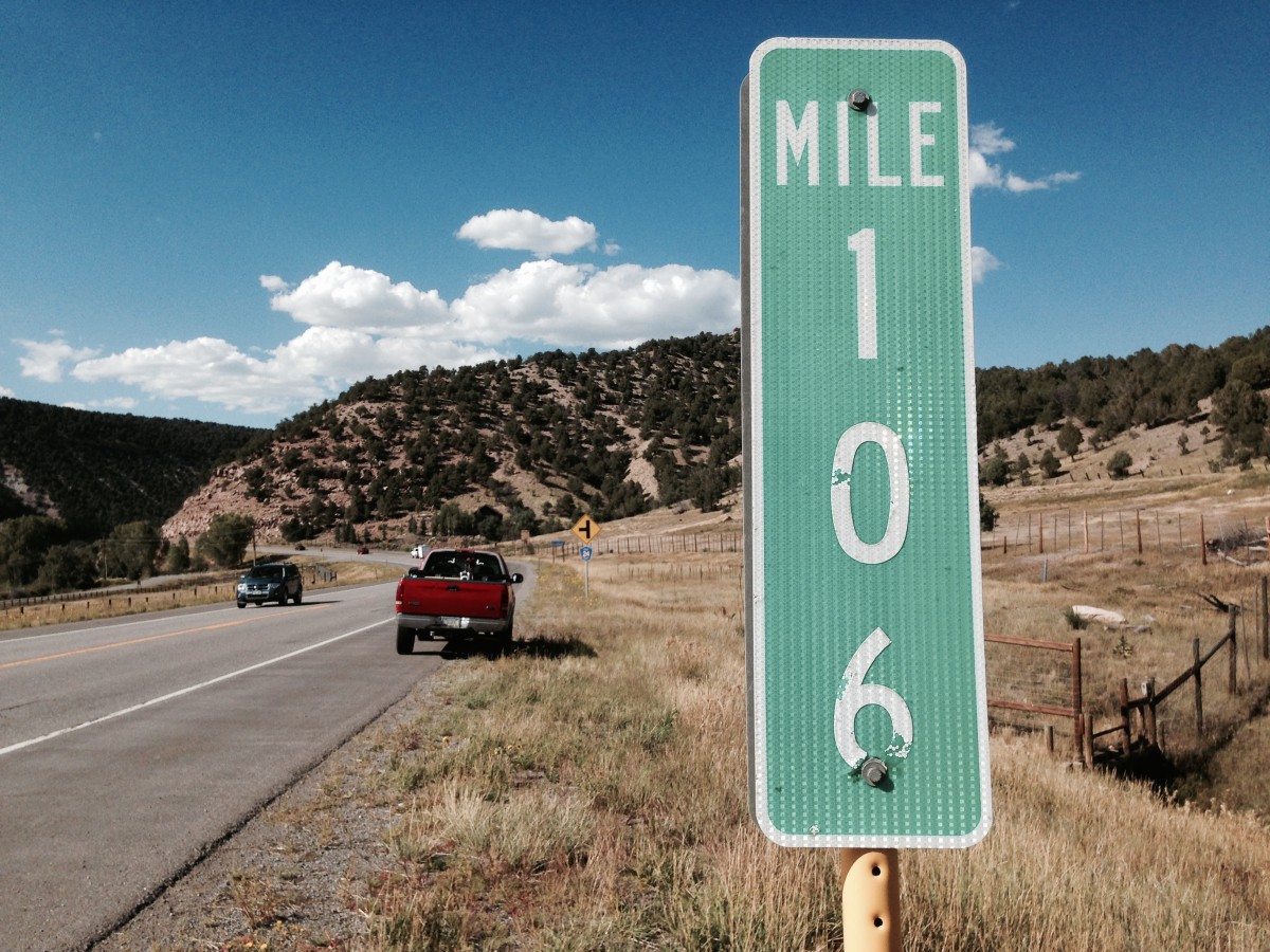 Mile marker sign showing mile 106.