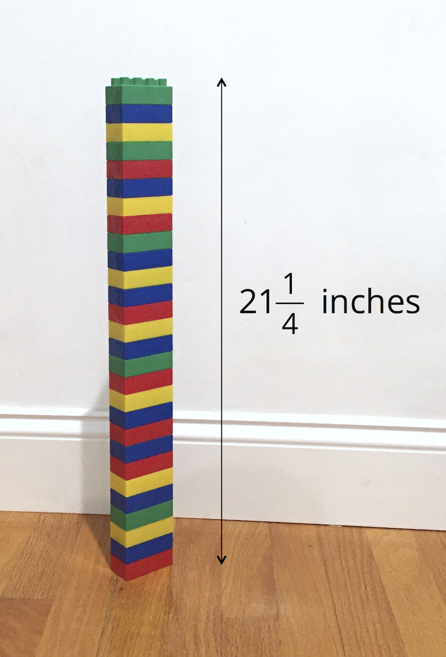 tower of playing bricks 21 and 1 fourth inches high.