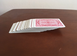 A stack of cards are shown with a slant