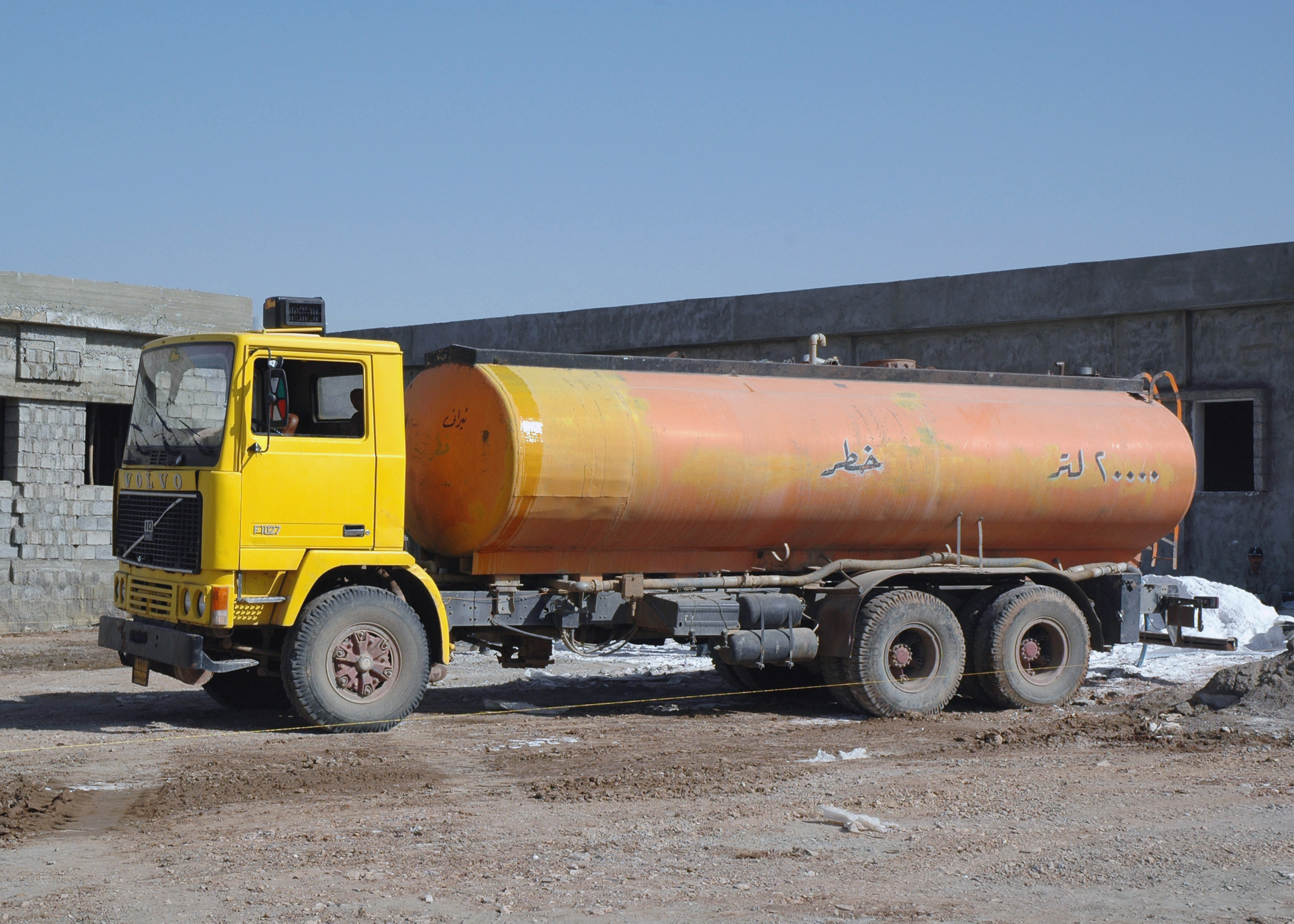 An image labeled "E", a photo of an 18-wheeler tanker truck with a cylinder-shaped tank.