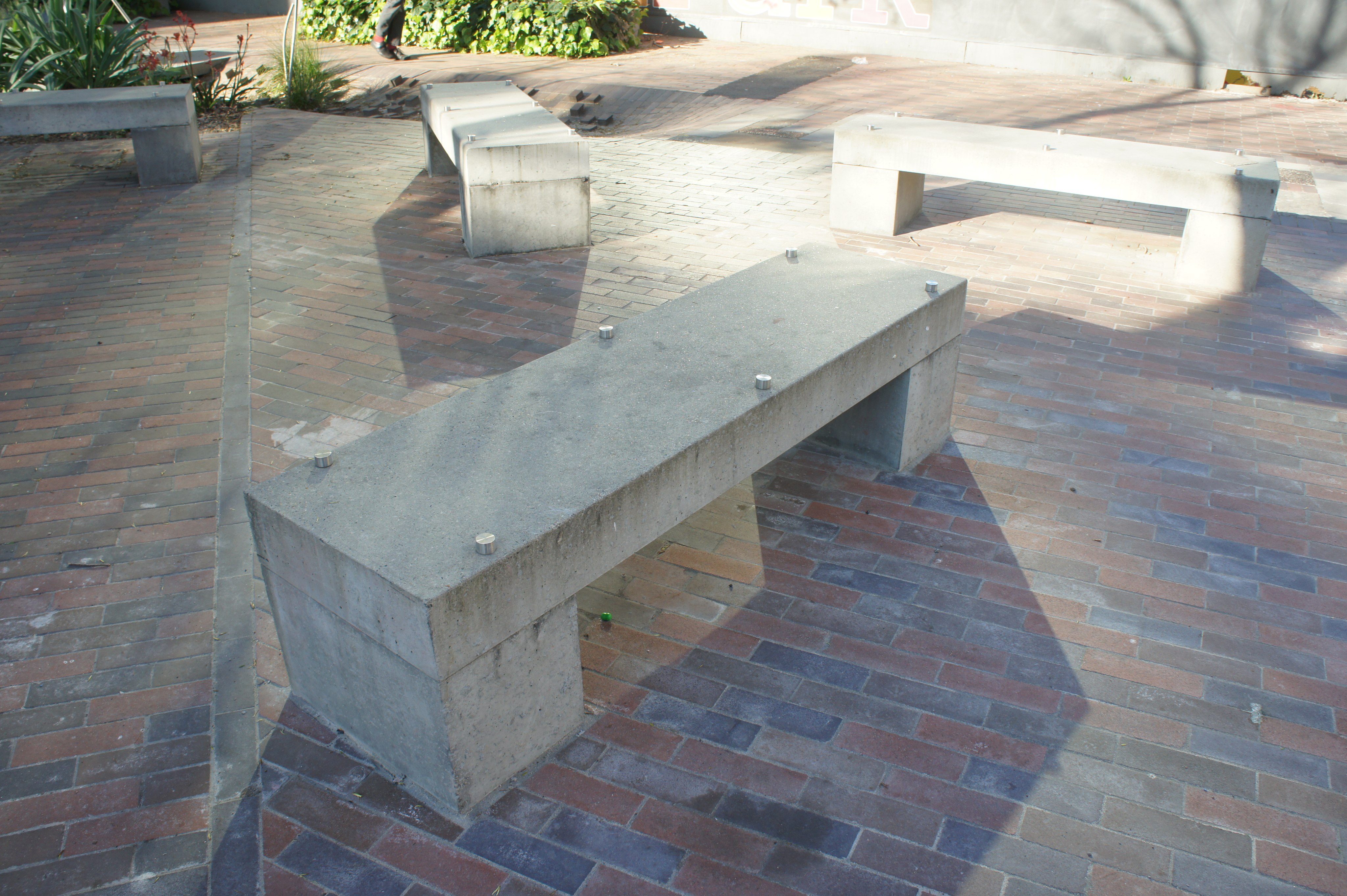 A photo of a concrete bench