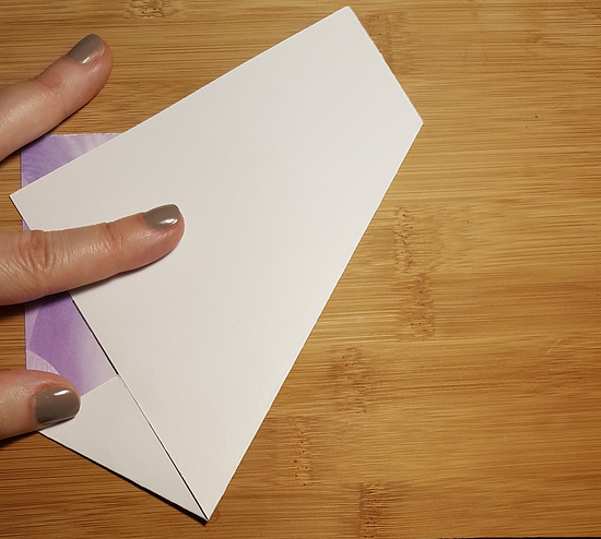 A piece of paper with 2 folds in it.